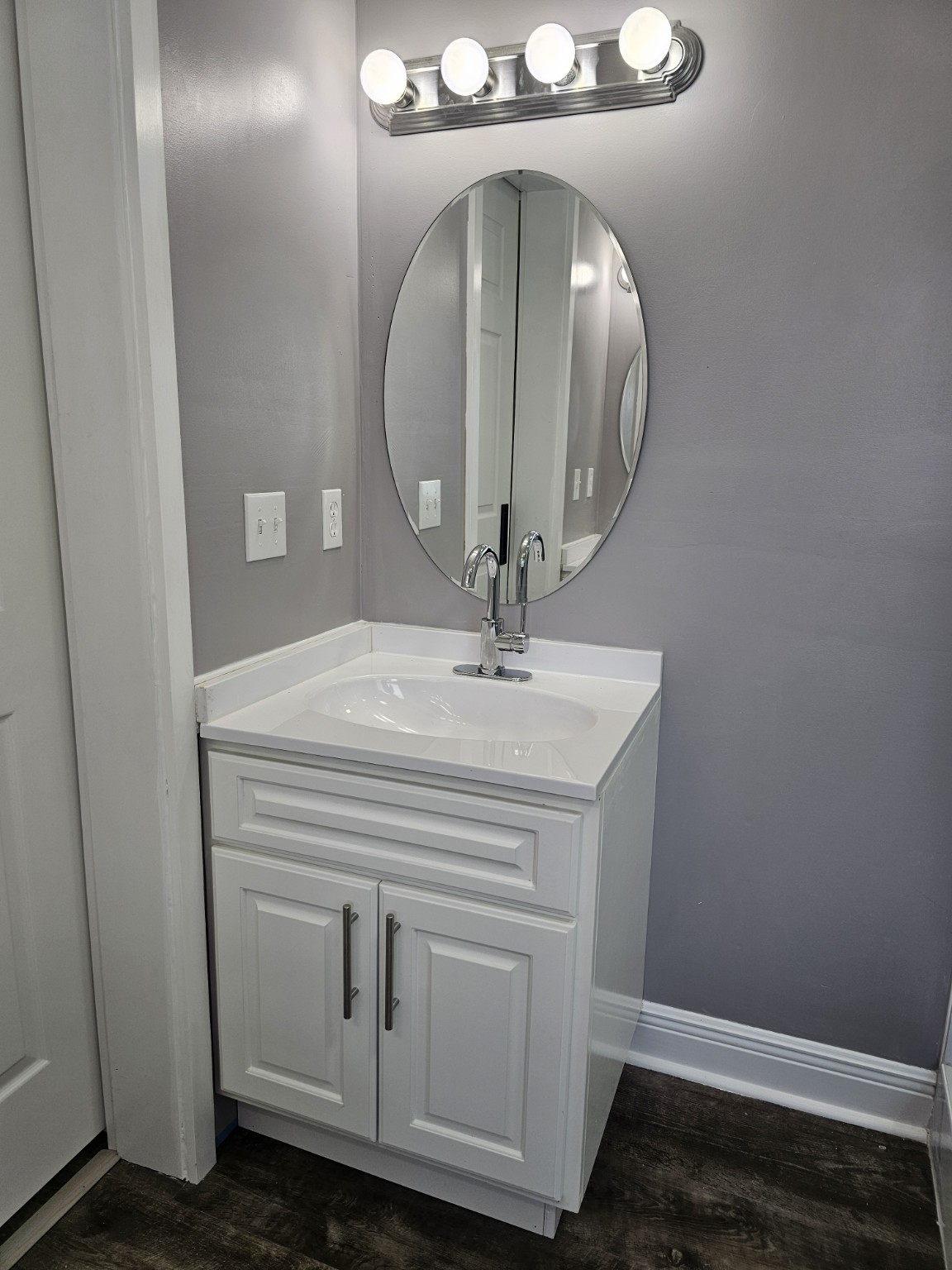 Compact painted vanity by Hilltop Cabinets LLC
